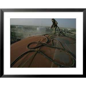  A Laborer Works at an Oil Refinery in Saudi Arabia Framed 