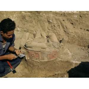  Man Uncovers an Idol Broken before its Burial Photographic 