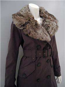 Double breasted trench coat has detachable faux fur collar, front flap 