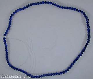 Unstrung royal blue 4 mm lapis lazuli beads. The strand has 104 beads 