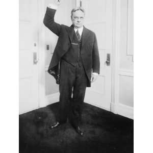 Hiram W. Johnson, standing, full length, with right arm raised Hiram 
