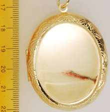 YBM lg. oval engraved locket, black cameo, N & cherub  
